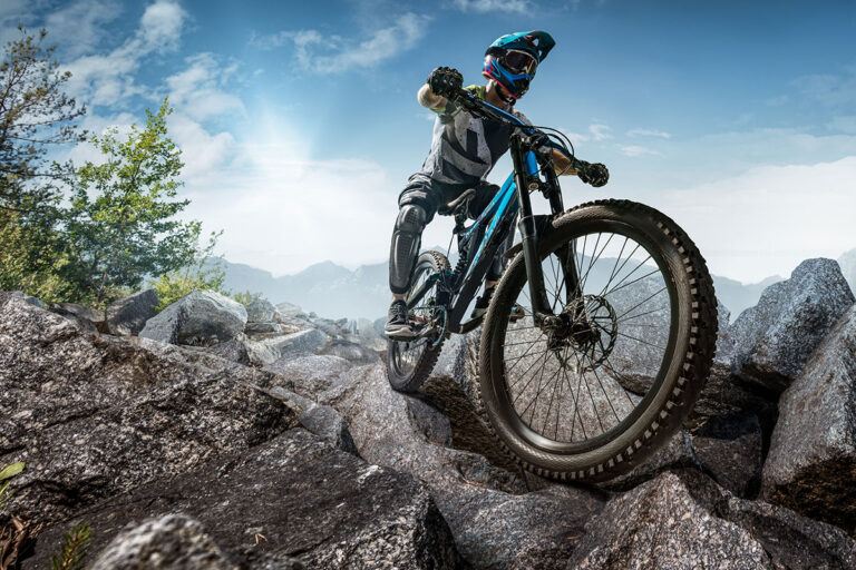 Off road biking on a rocky trail.