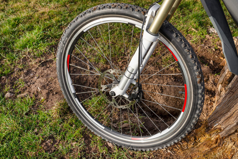 Front wheel of a bicycle with brakes.