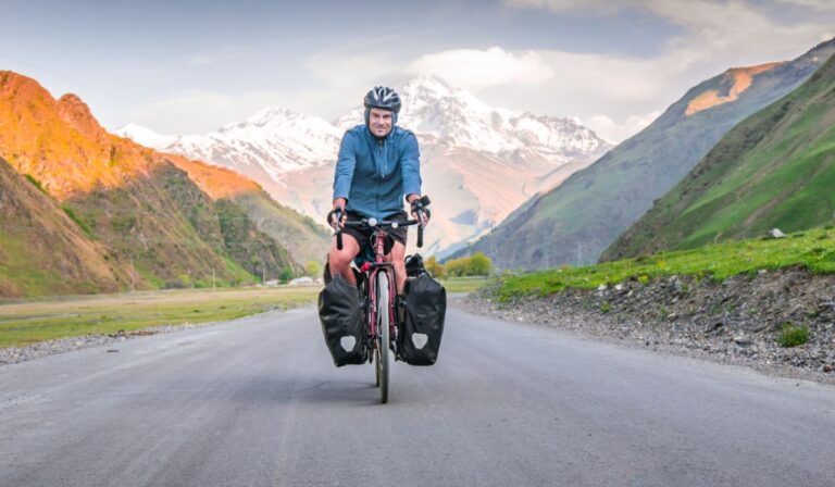 A person biking with his mountain with Panniers.