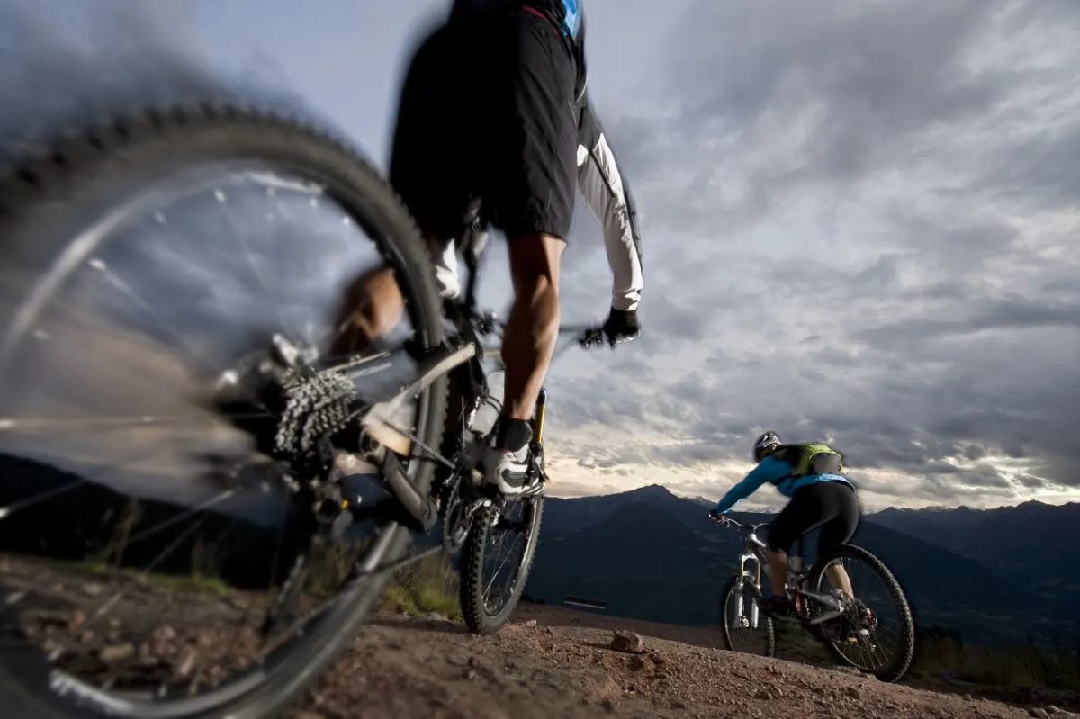 Cyclists riding on a cloudy weather.