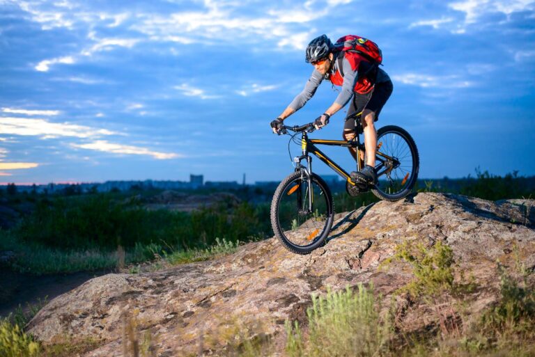 A person with mountain bike in full gear.