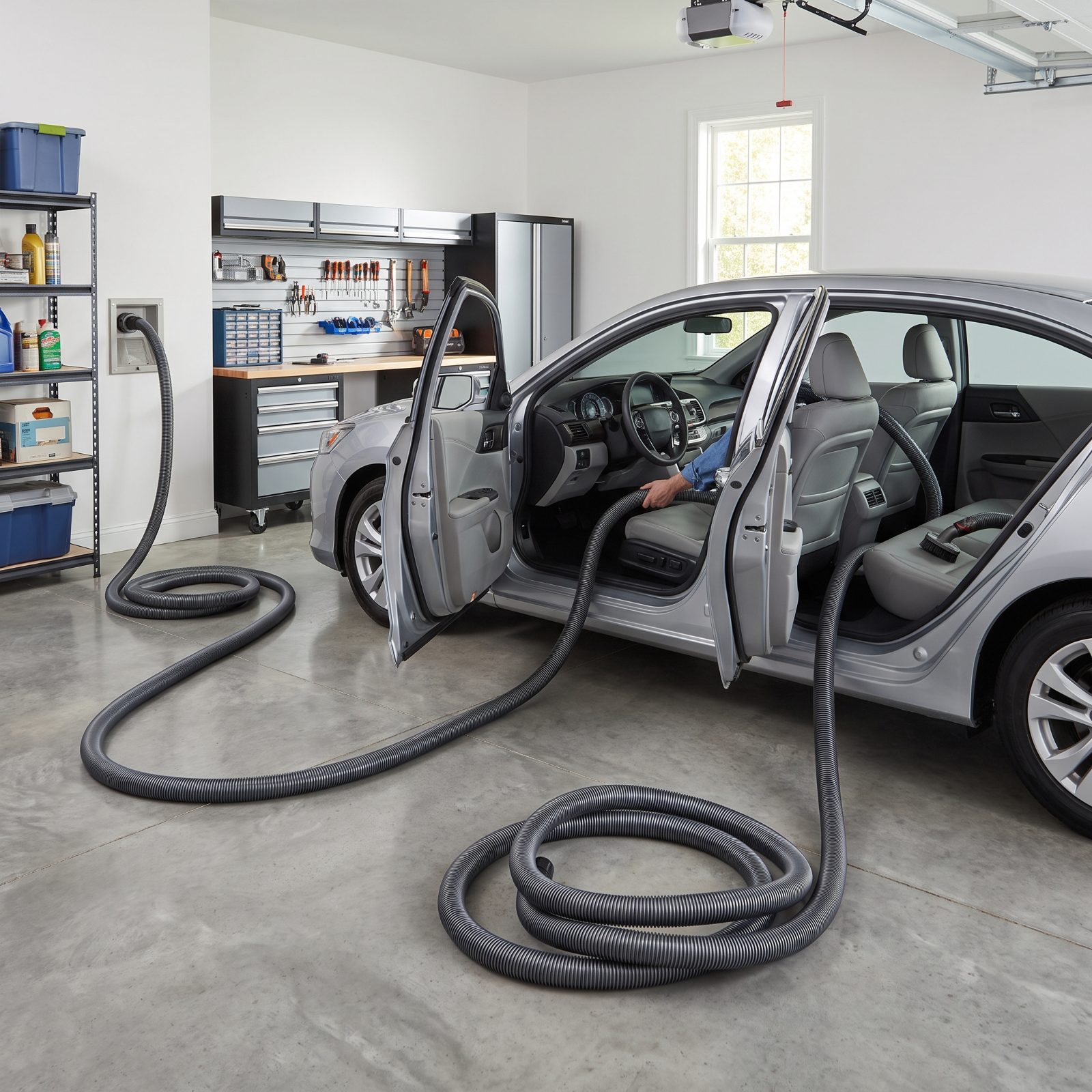 Central Vacuum With a Vehicle-Length Hose
