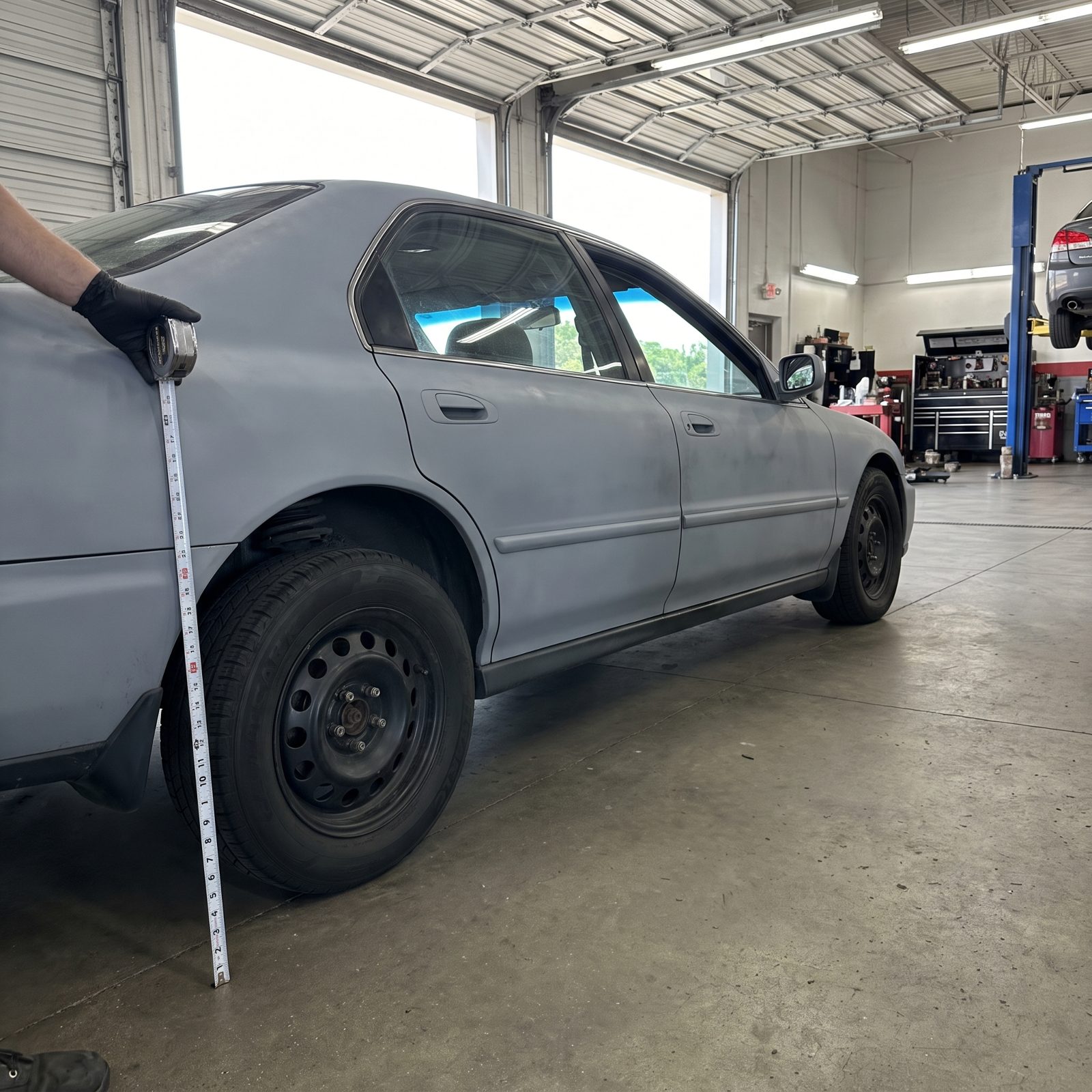 One Corner Sitting Lower: Uneven Ride Height That Gives Away a Tired Spring or an Air-Suspension Leak