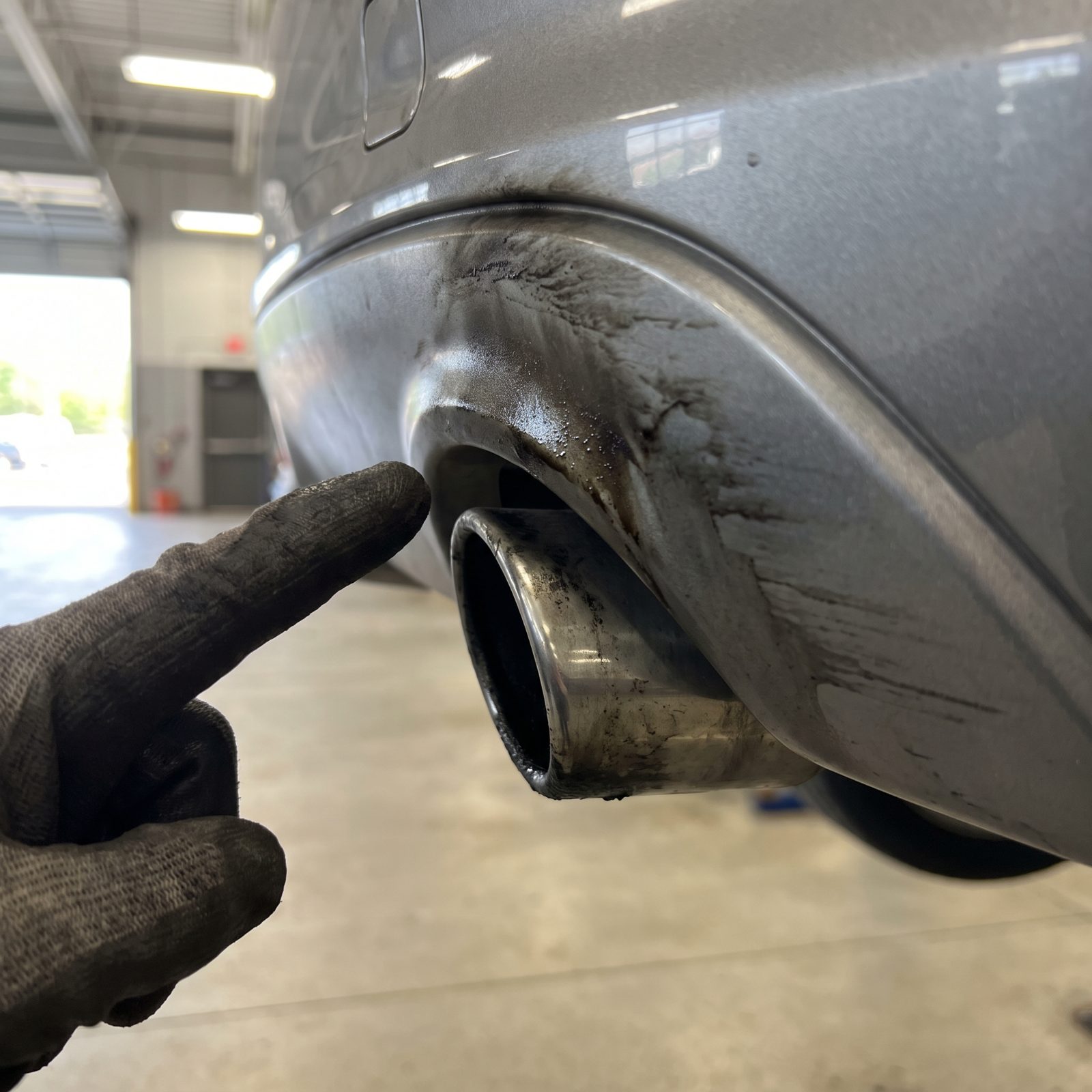 Soot Painted Outside the Tailpipe: A Smudge Pattern That Points to a Leak or Bad Burn